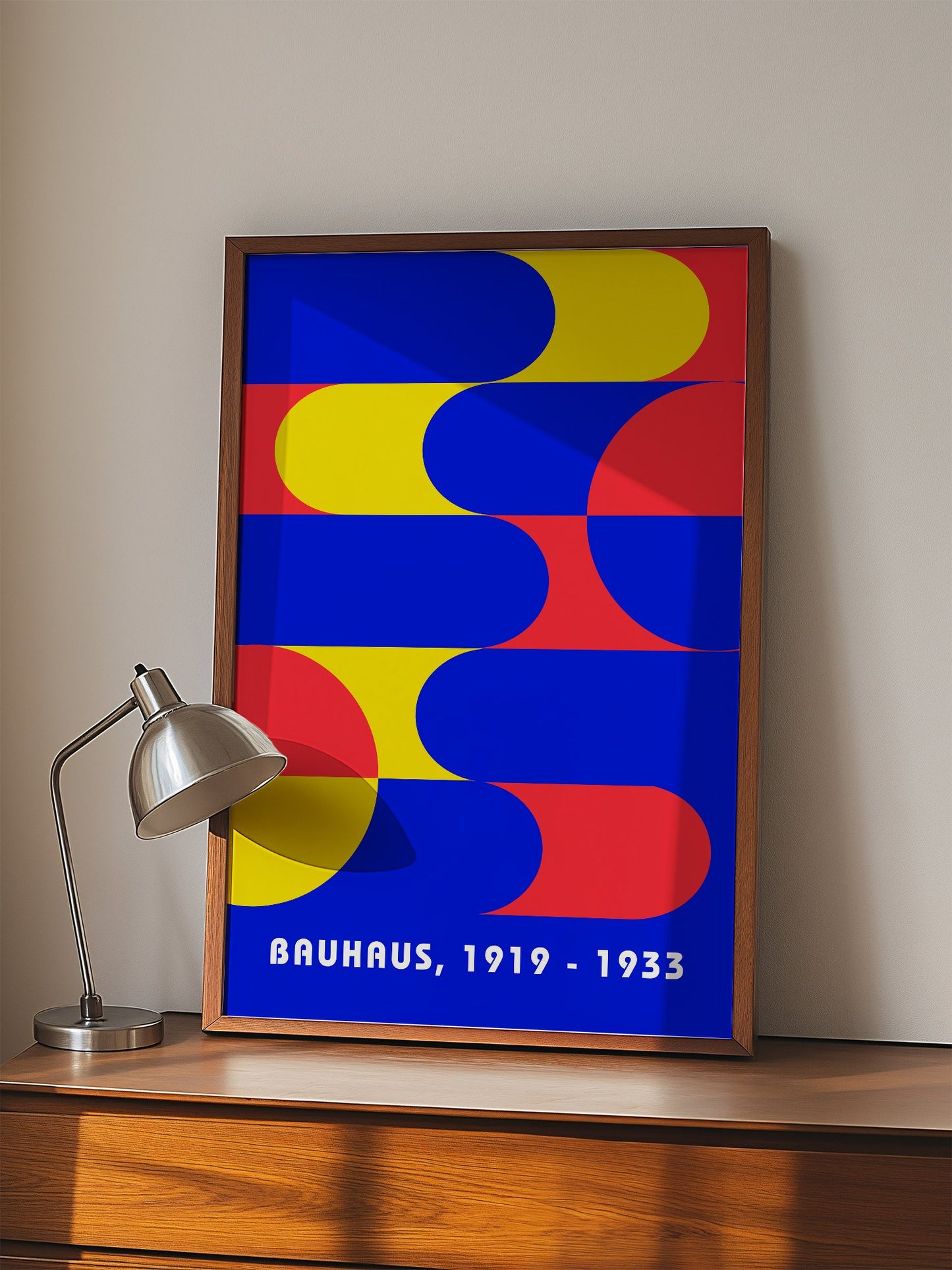 Bauhaus geometric abstract poster with interlocking blue yellow and red shapes, displayed in modern living room setting