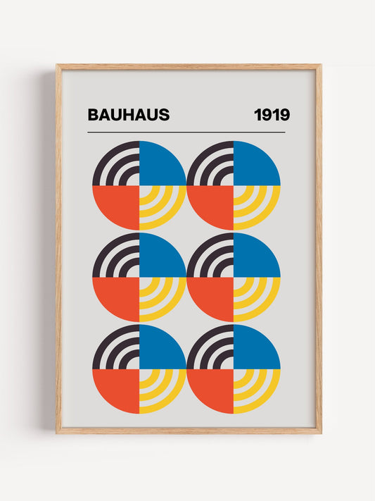 Bauhaus 1919 geometric poster with six circular motifs in blue, yellow, coral, close-up showing print texture and color de...