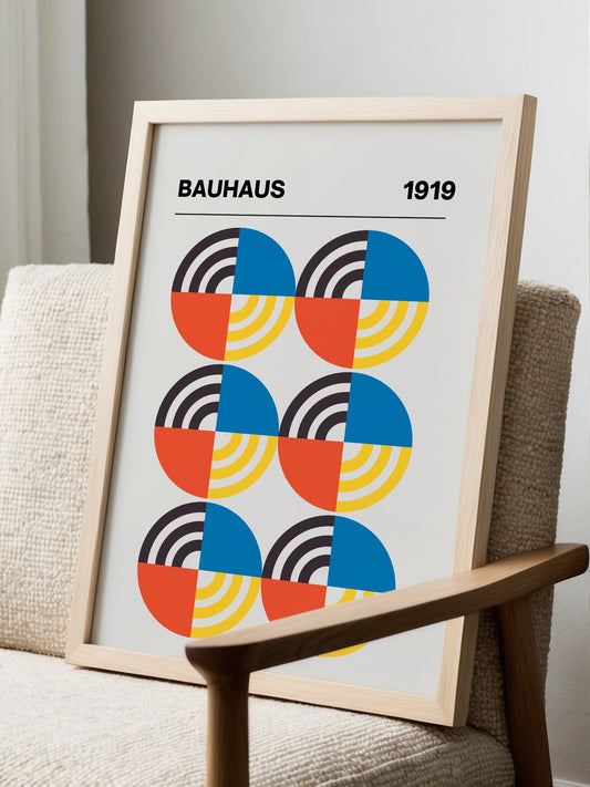 Bauhaus 1919 geometric poster with six circular motifs in blue, yellow, coral, displayed in modern living room setting