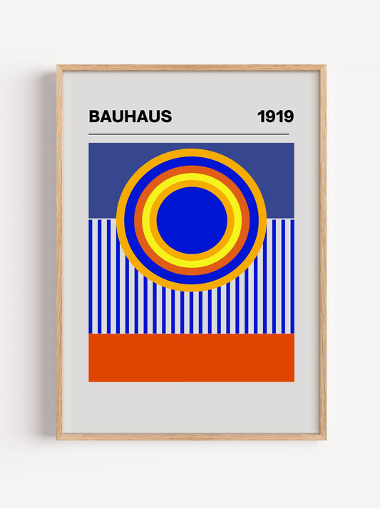 Bauhaus 1919 poster with concentric circles in yellow orange red and blue, close-up showing print texture and color detail