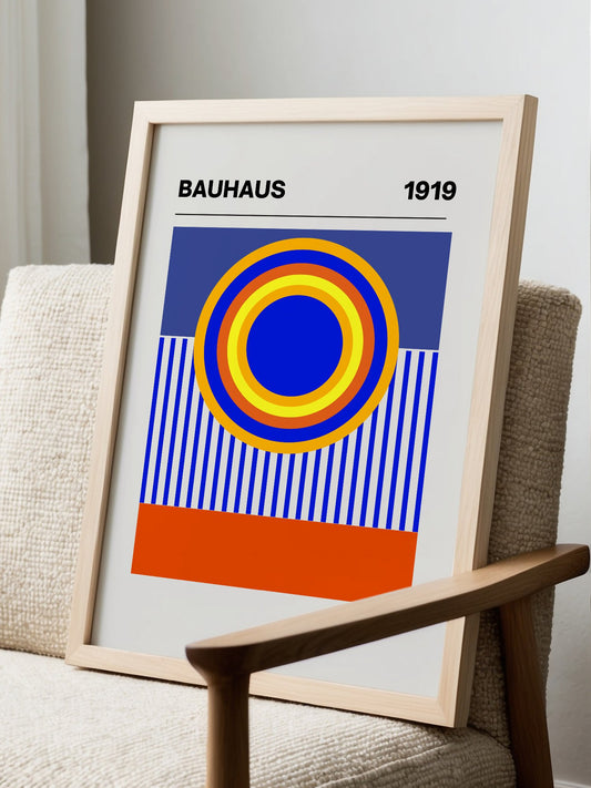 Bauhaus 1919 poster with concentric circles in yellow orange red and blue, displayed in modern living room setting