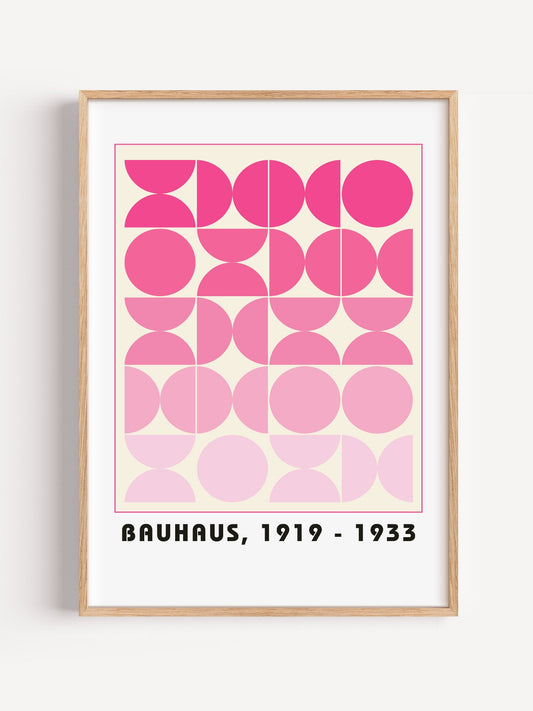 Bauhaus geometric poster featuring pink circles and semicircles in gradient, close-up showing print texture and color detail
