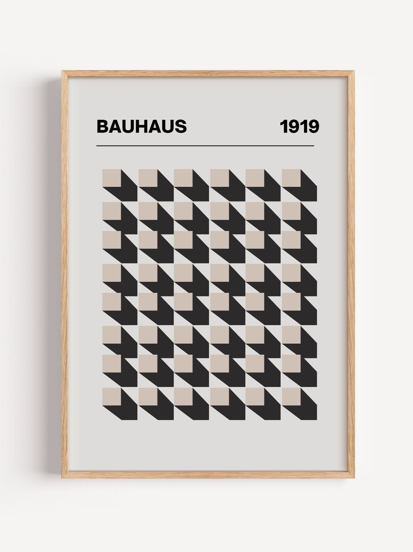 Bauhaus 1919 poster featuring grid of black and beige isometric cubes in, close-up showing print texture and color detail