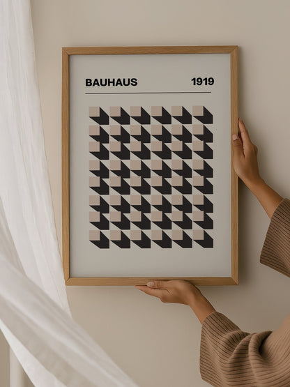 Bauhaus 1919 poster featuring grid of black and beige isometric cubes in, hanging in contemporary bedroom interior