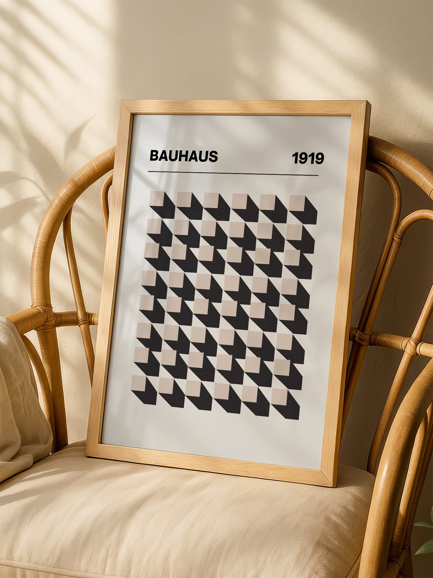 Bauhaus 1919 poster featuring grid of black and beige isometric cubes in, shown in minimalist home office space