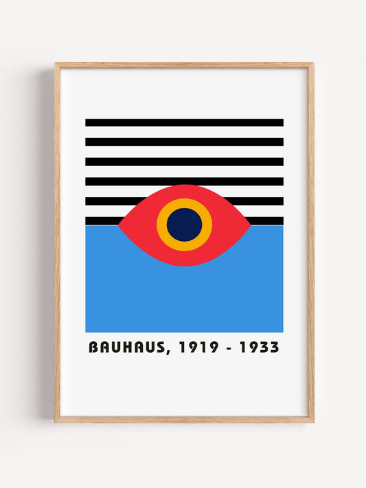 Bauhaus geometric eye poster with concentric red yellow and blue circles, close-up showing print texture and color detail