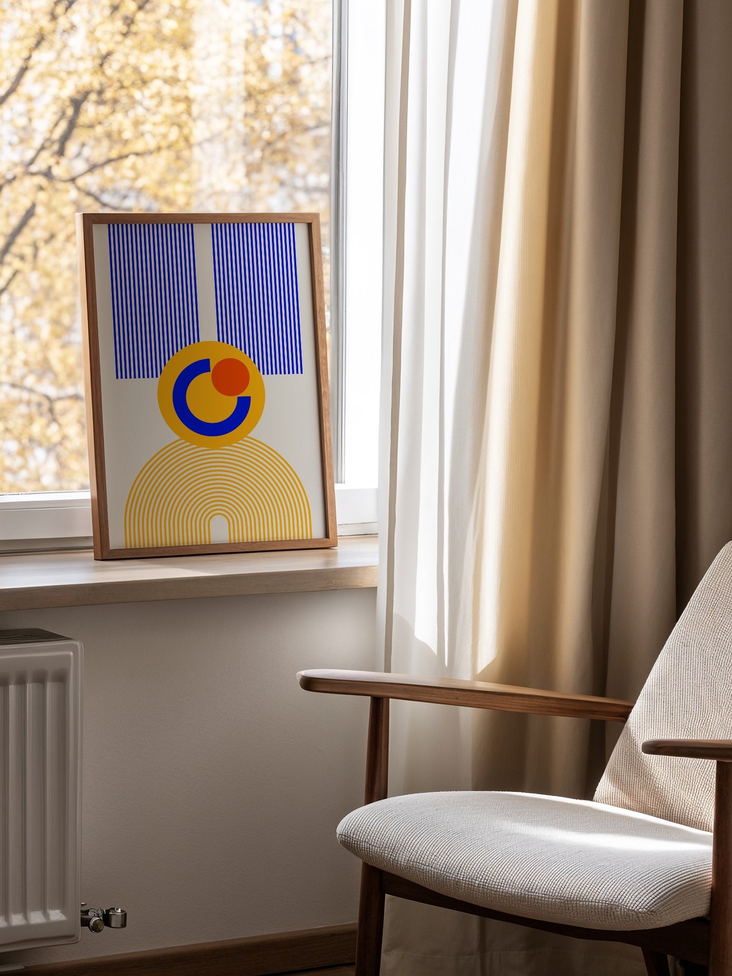 Bauhaus geometric abstract figure with concentric yellow stripes, blue crescent, mounted in bright gallery wall arrangement