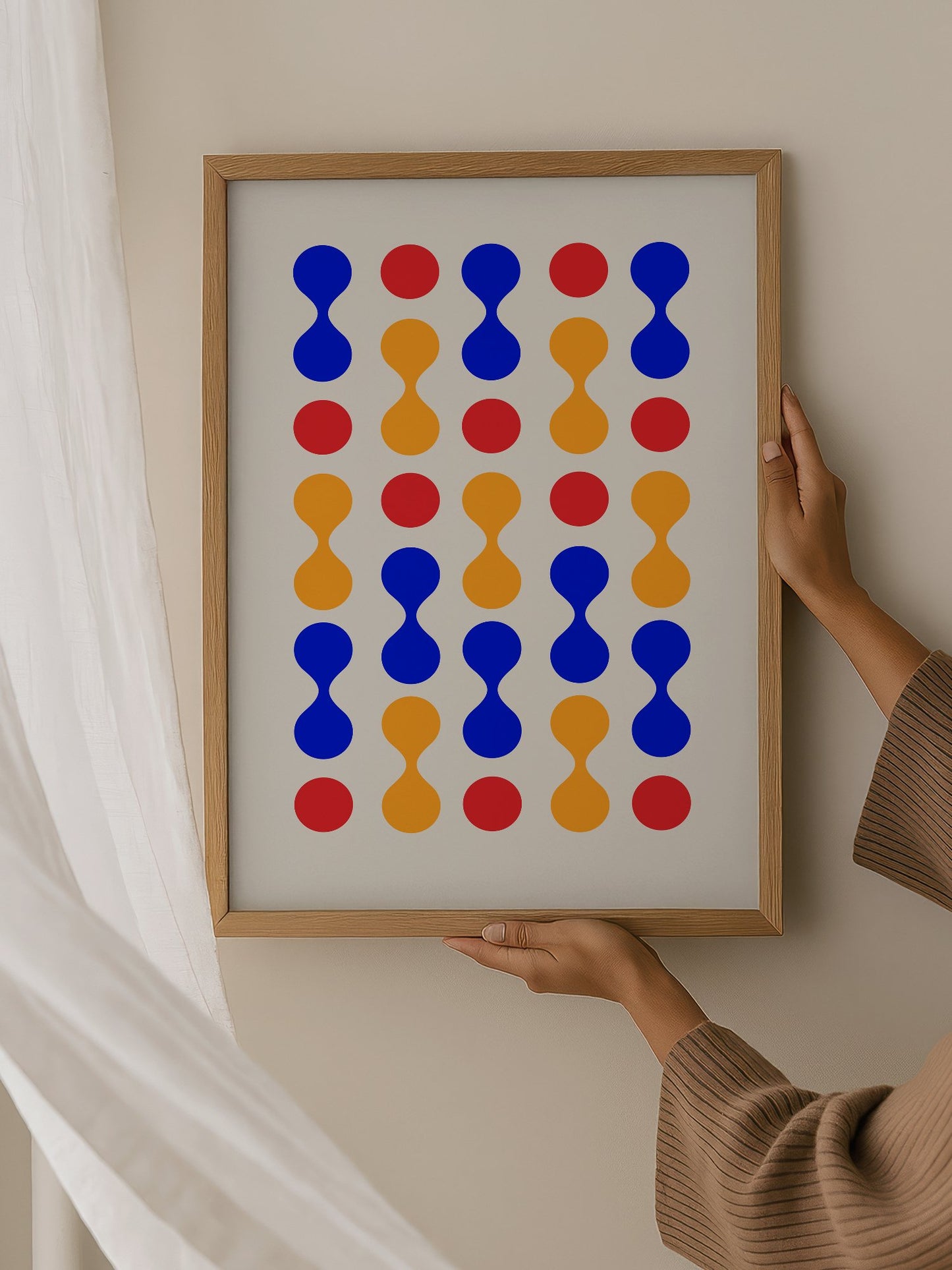 Bauhaus geometric wall art print featuring blue hourglass shapes and red orange, hanging in contemporary bedroom interior