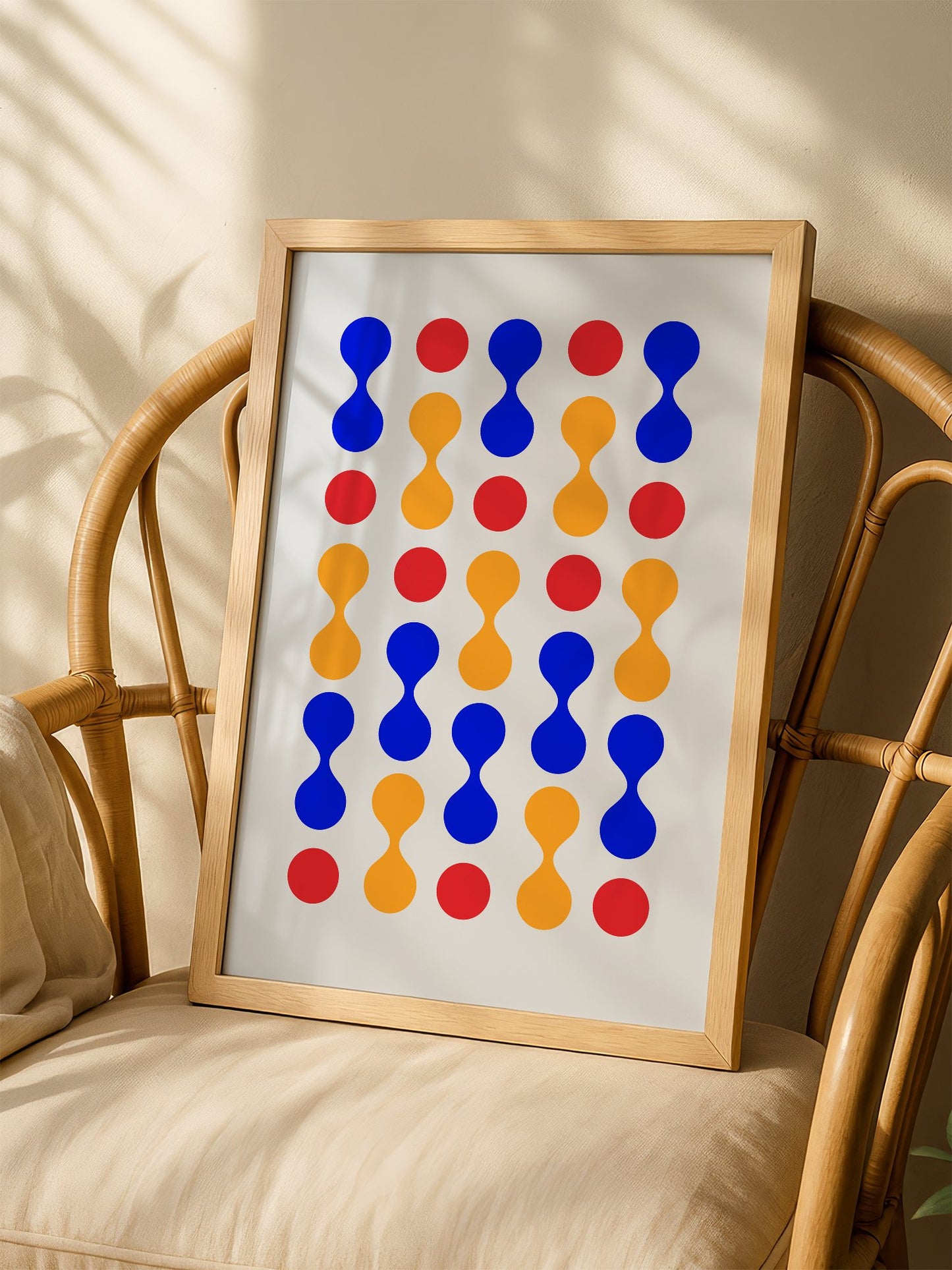 Bauhaus geometric wall art print featuring blue hourglass shapes and red orange, shown in minimalist home office space