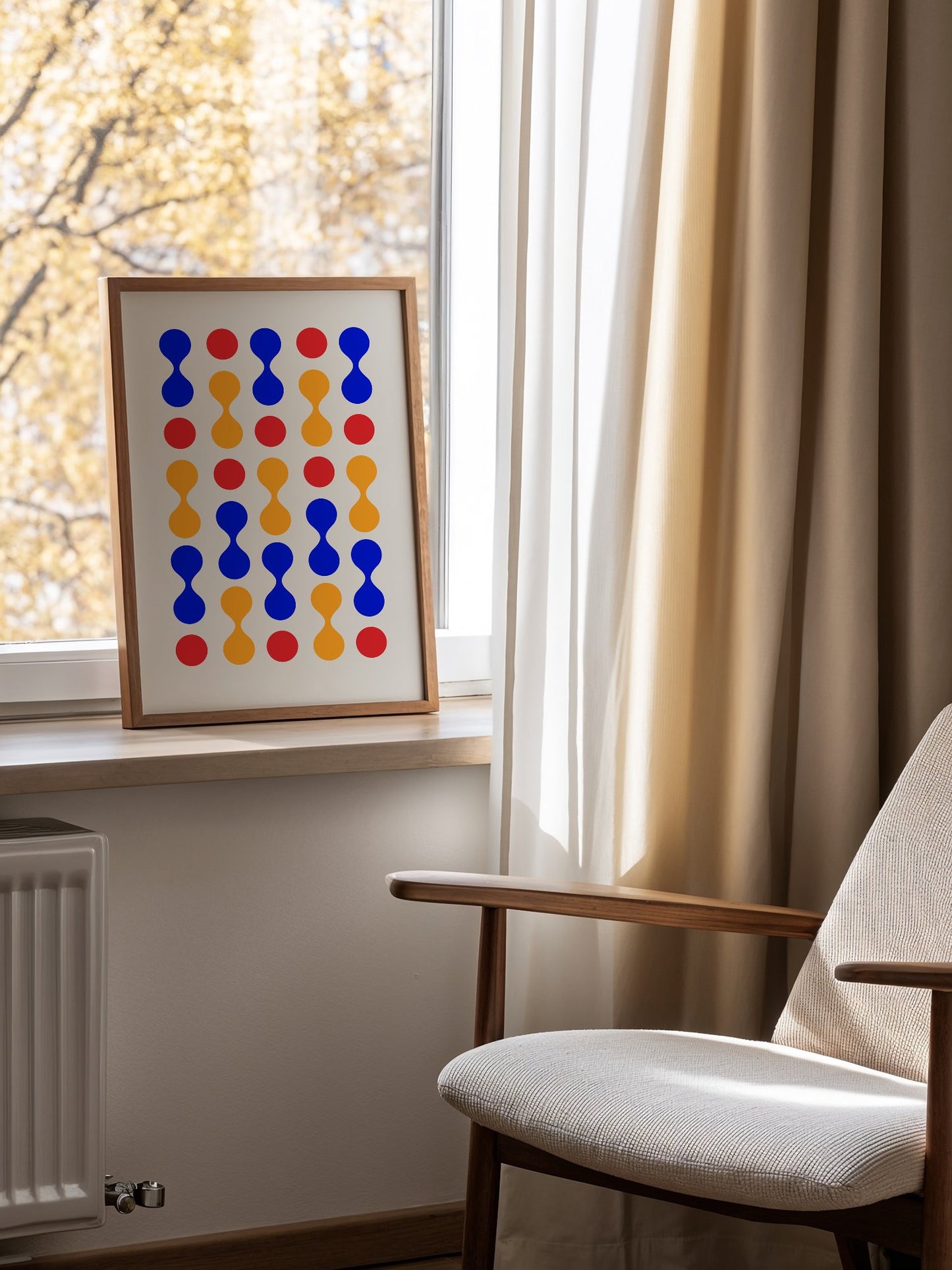 Bauhaus geometric wall art print featuring blue hourglass shapes and red orange, mounted in bright gallery wall arrangement