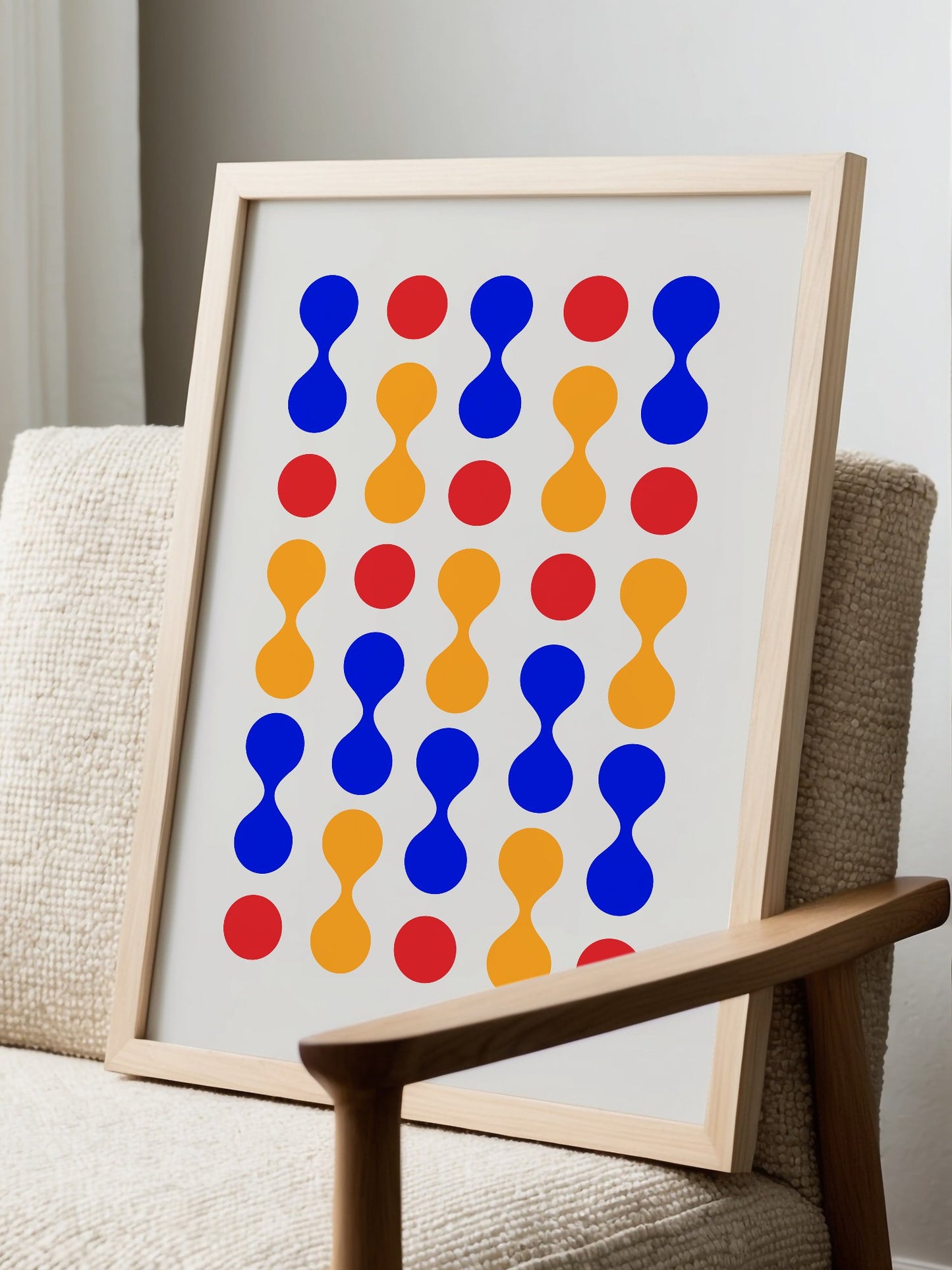 Bauhaus geometric wall art print featuring blue hourglass shapes and red orange, displayed in modern living room setting