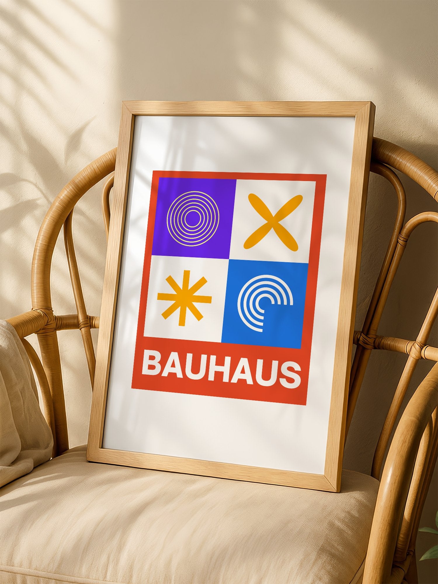 Bauhaus poster with geometric grid design featuring concentric circles, shown in minimalist home office space