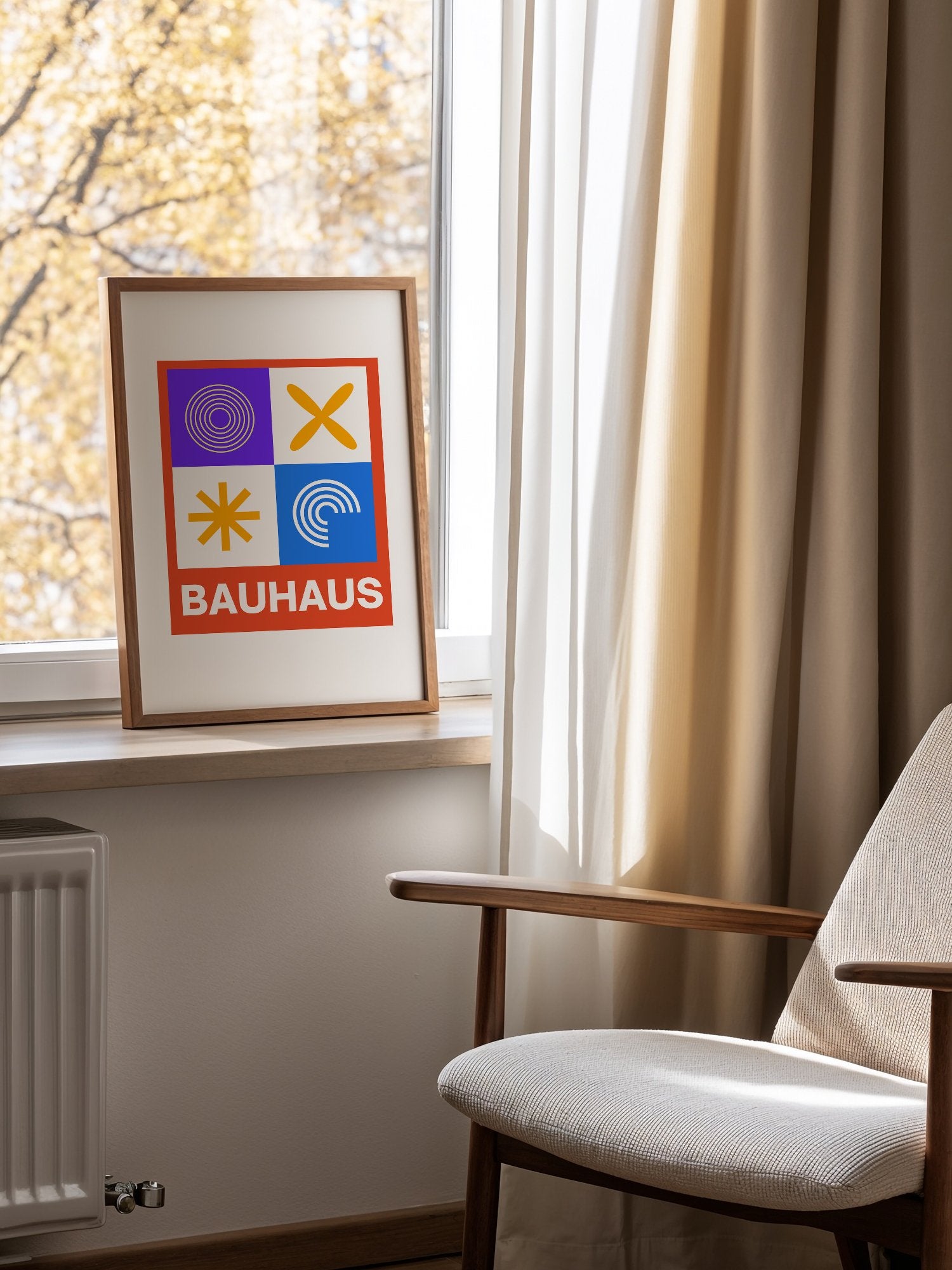 Bauhaus poster with geometric grid design featuring concentric circles, mounted in bright gallery wall arrangement