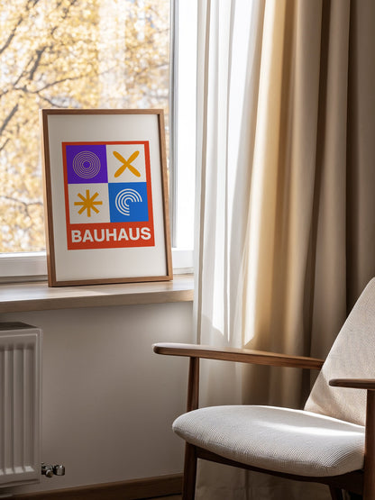 Bauhaus poster with geometric grid design featuring concentric circles, mounted in bright gallery wall arrangement