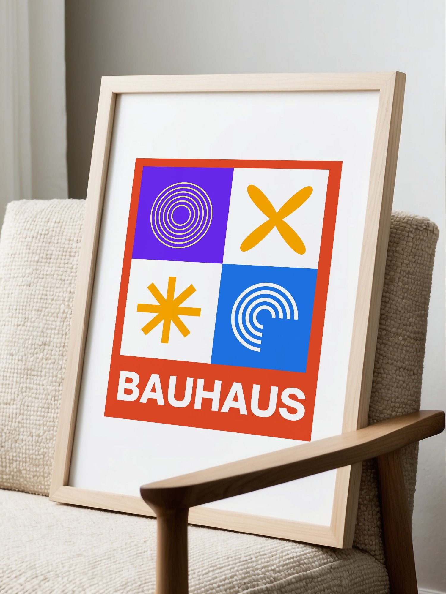 Bauhaus poster with geometric grid design featuring concentric circles, displayed in modern living room setting