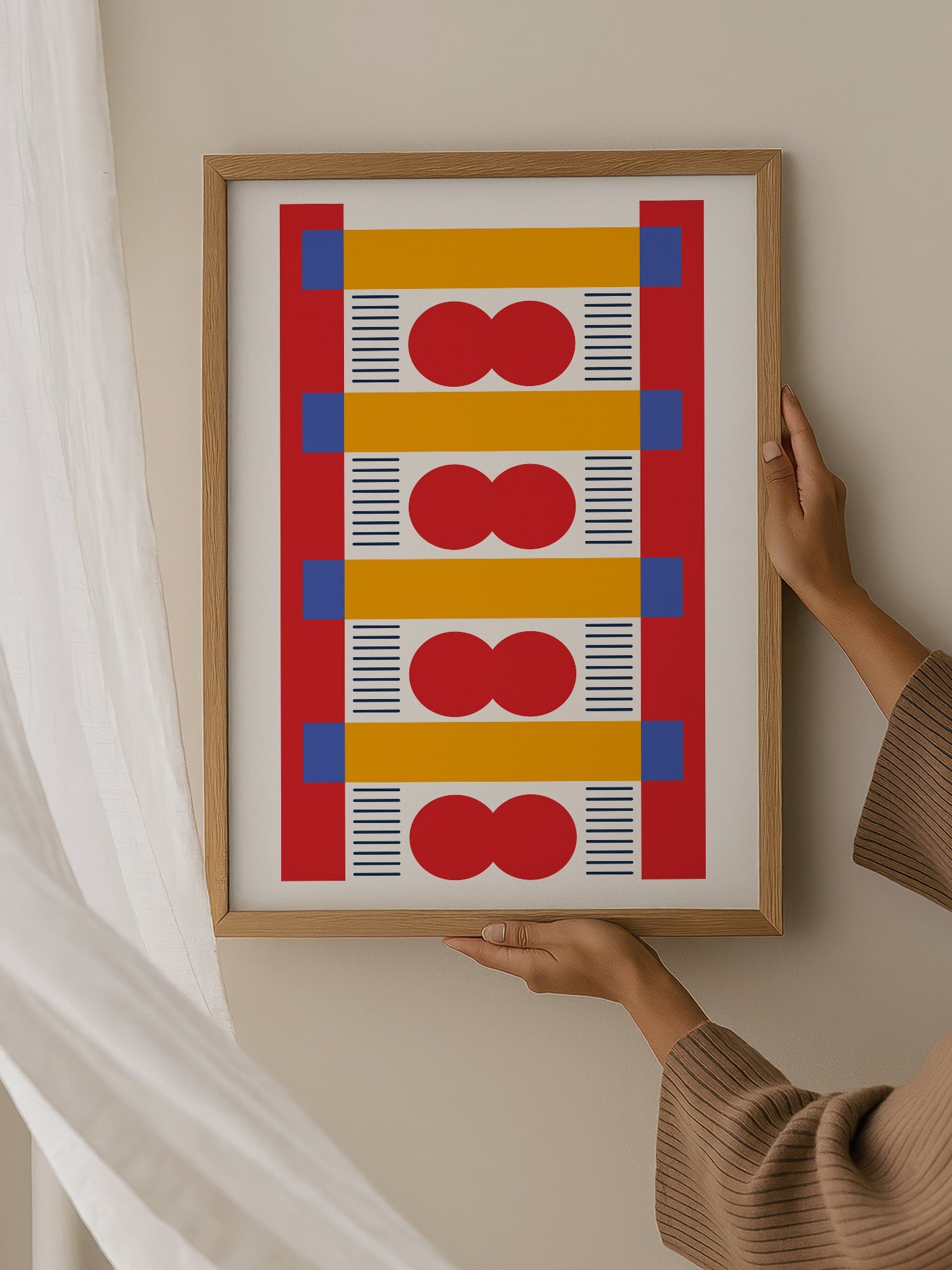 Bauhaus geometric wall art with red infinity symbols, yellow bands, and blue, hanging in contemporary bedroom interior