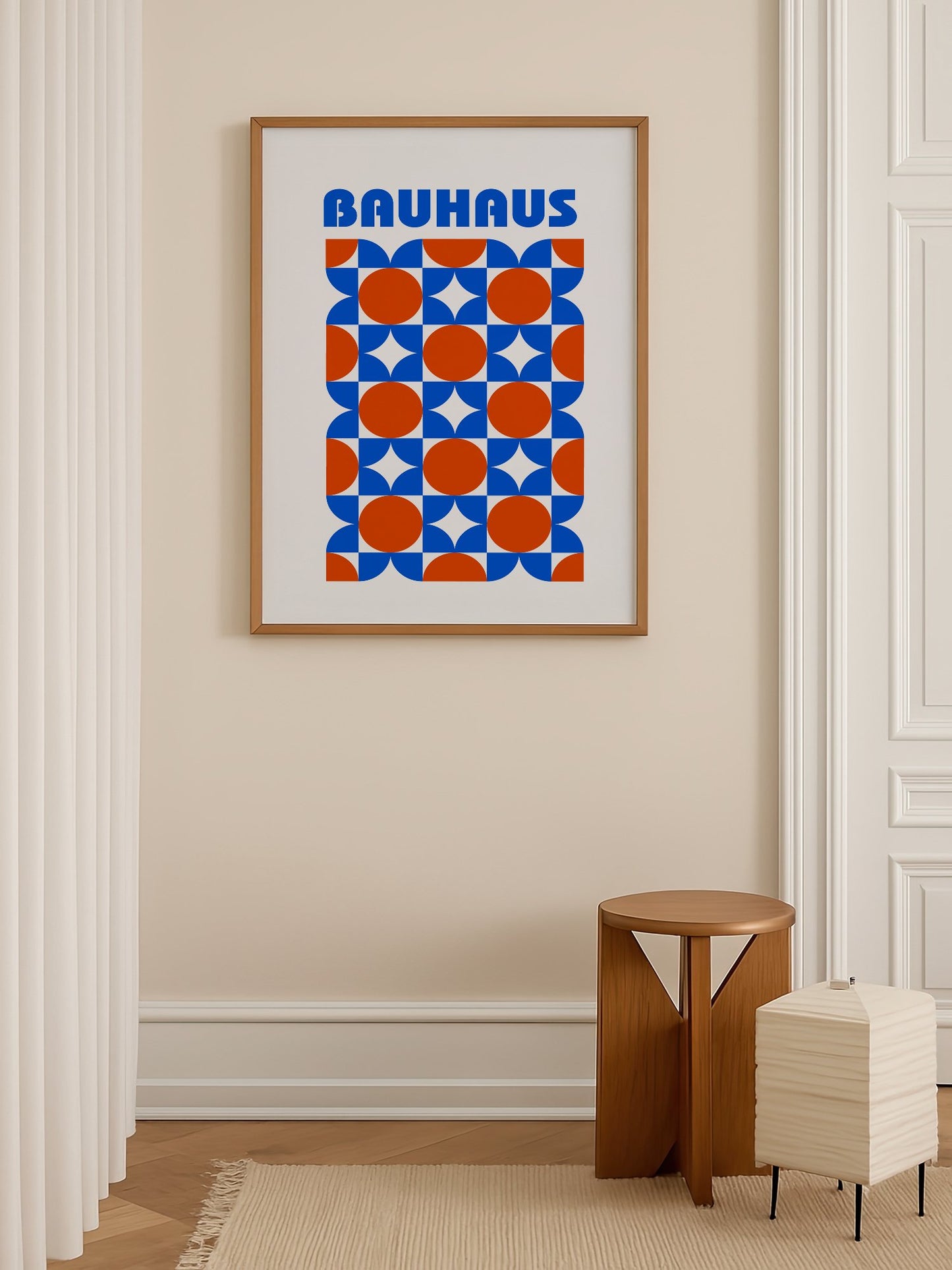 Bauhaus geometric poster with blue and orange quarter-circles in symmetrical, shown in minimalist home office space