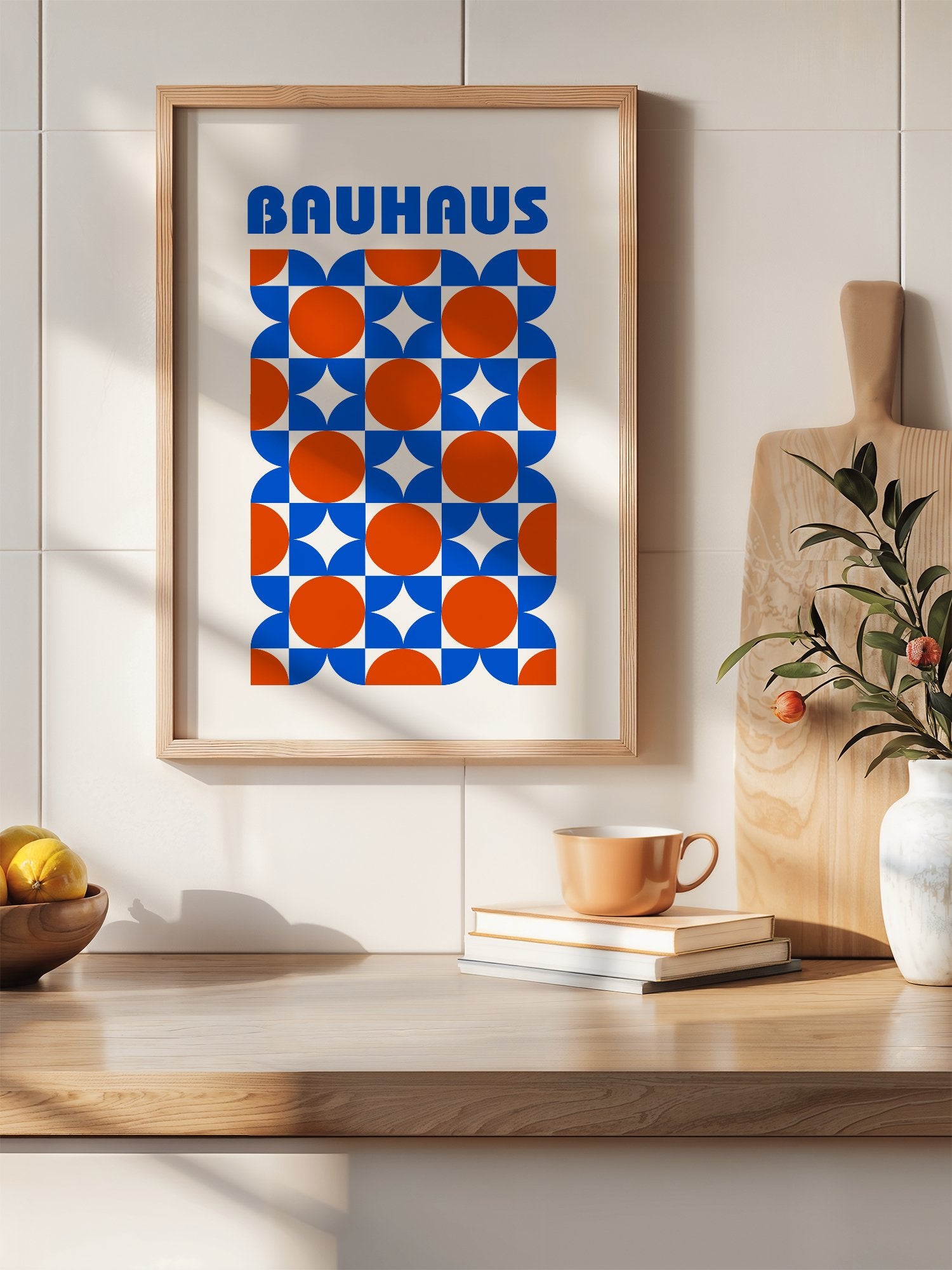 Bauhaus geometric poster with blue and orange quarter-circles in symmetrical, hanging in contemporary bedroom interior