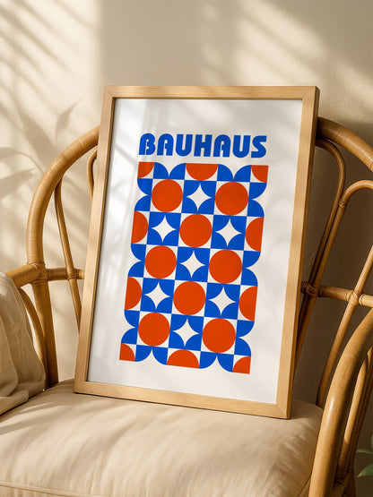 Bauhaus geometric poster with blue and orange quarter-circles in symmetrical, shown in minimalist home office space