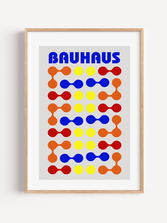 Bauhaus poster with bold blue typography and geometric grid pattern of circles, close-up showing print texture and color d...