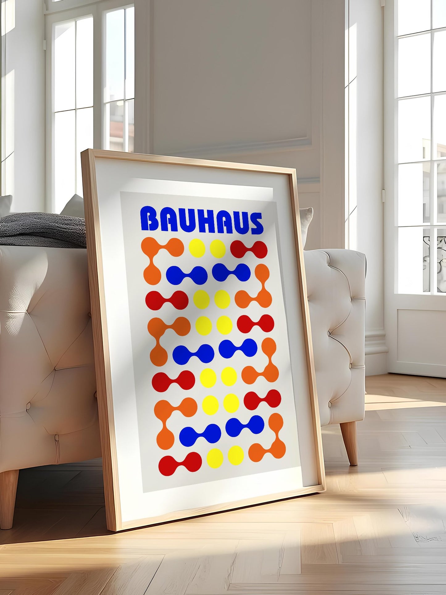 Bauhaus poster with bold blue typography and geometric grid pattern of circles, featured in stylish apartment decor