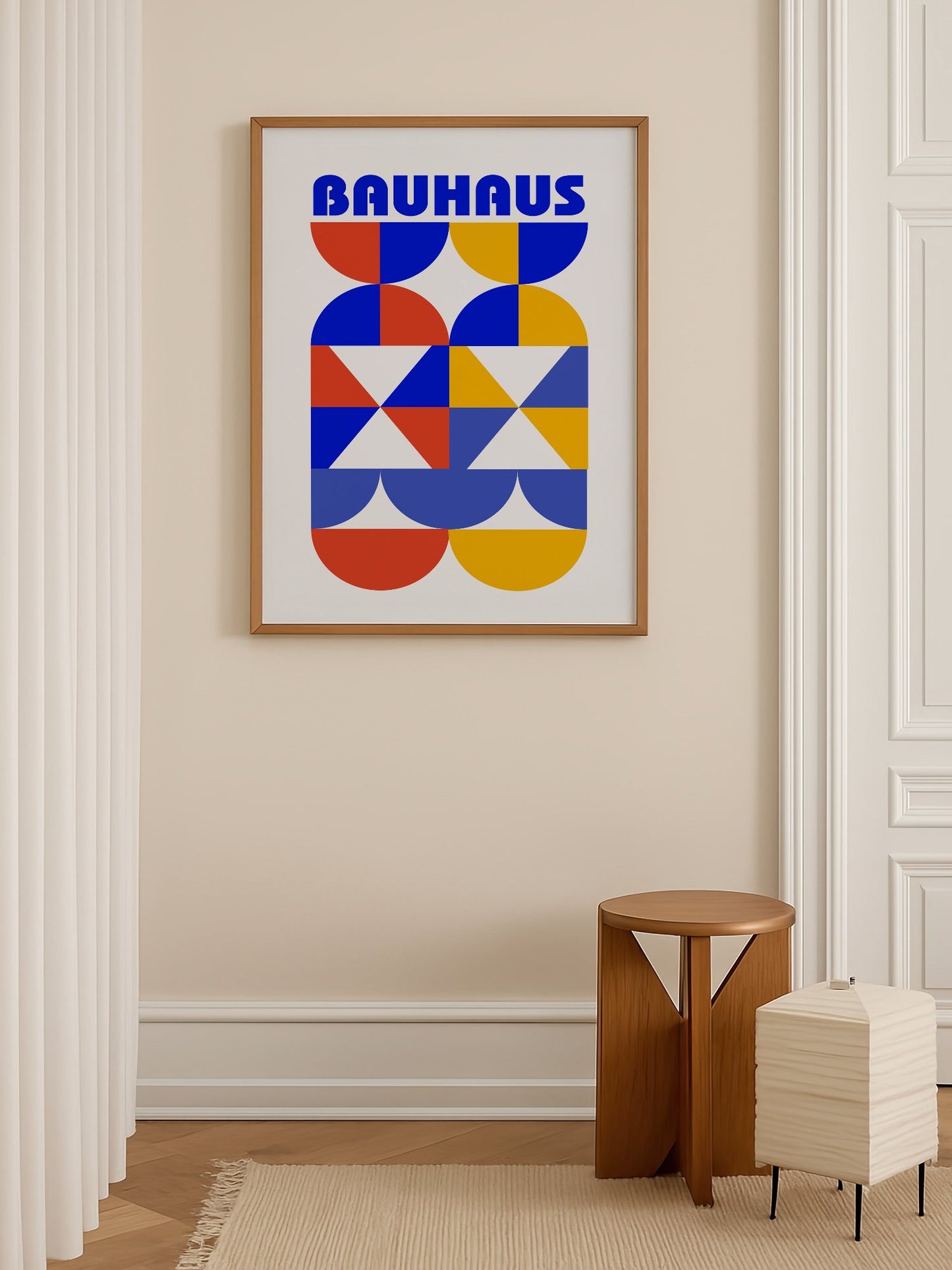 Bauhaus geometric poster featuring bold blue typography above symmetrical, shown in minimalist home office space