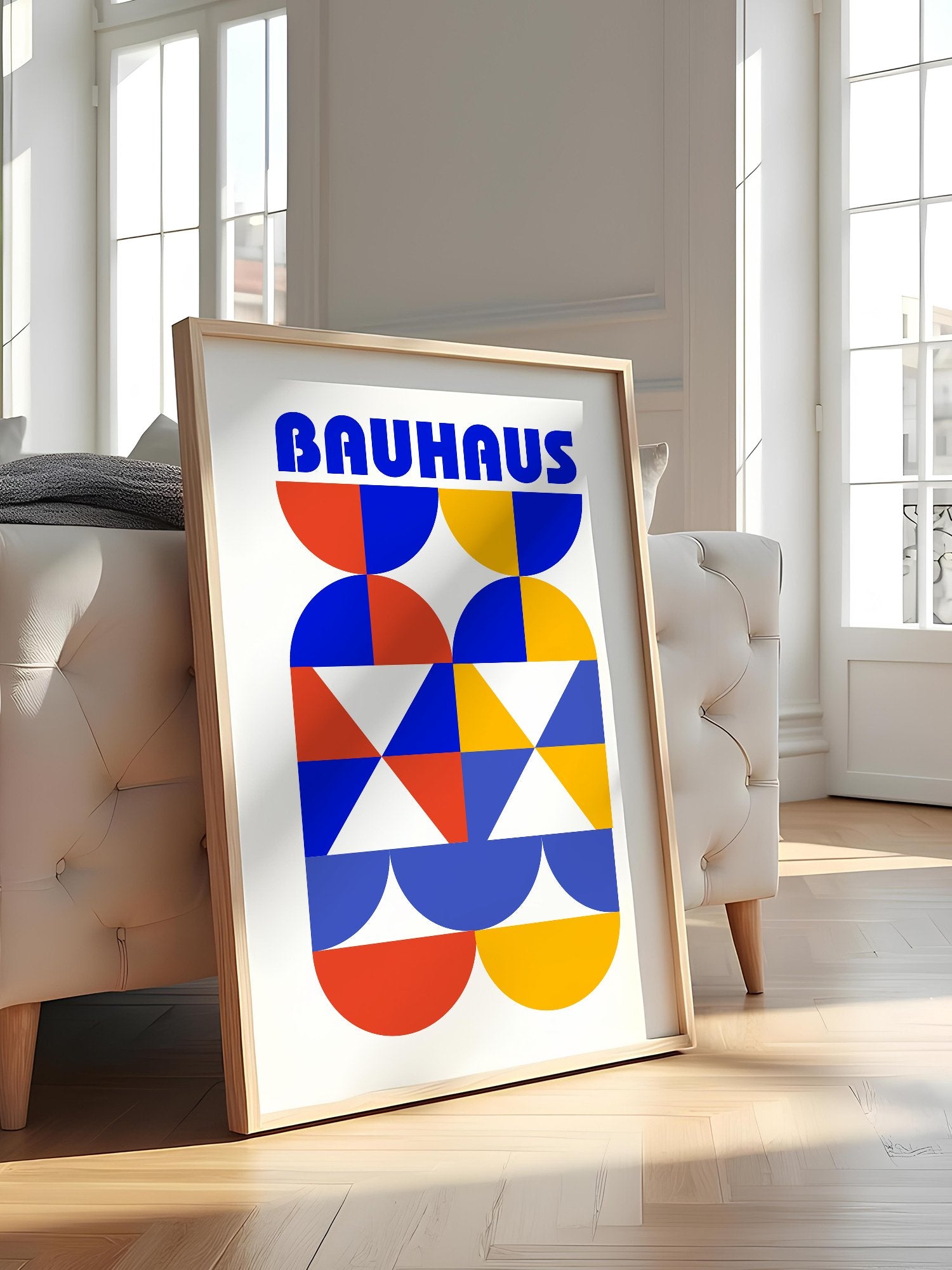 Bauhaus geometric poster featuring bold blue typography above symmetrical, featured in stylish apartment decor