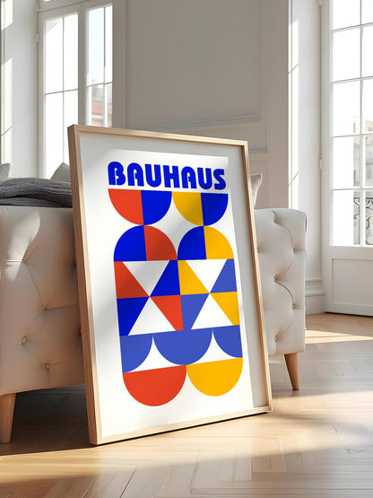 Bauhaus geometric poster featuring bold blue typography above symmetrical, featured in stylish apartment decor