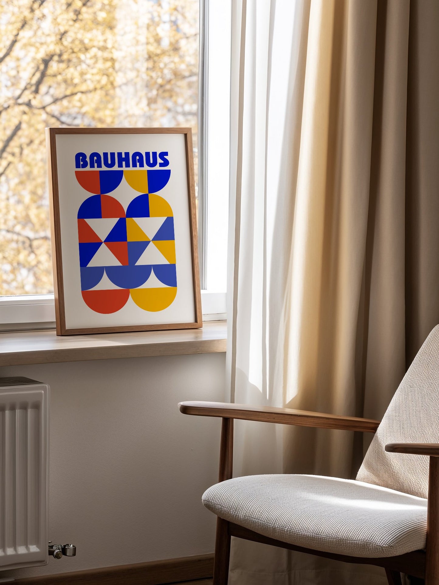 Bauhaus geometric poster featuring bold blue typography above symmetrical, mounted in bright gallery wall arrangement