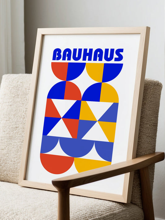 Bauhaus geometric poster featuring bold blue typography above symmetrical, displayed in modern living room setting