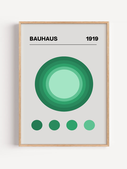 Bauhaus 1919 poster with concentric green circles in gradient shades on beige, close-up showing print texture and color de...