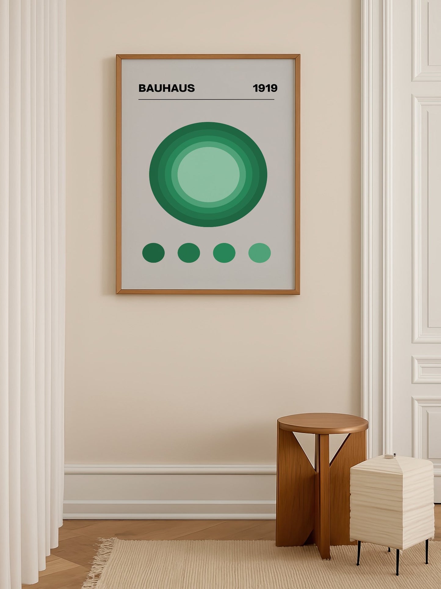 Bauhaus 1919 poster with concentric green circles in gradient shades on beige, shown in minimalist home office space