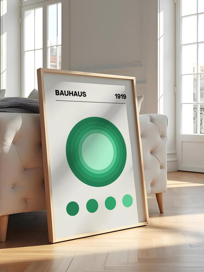 Bauhaus 1919 poster with concentric green circles in gradient shades on beige, featured in stylish apartment decor