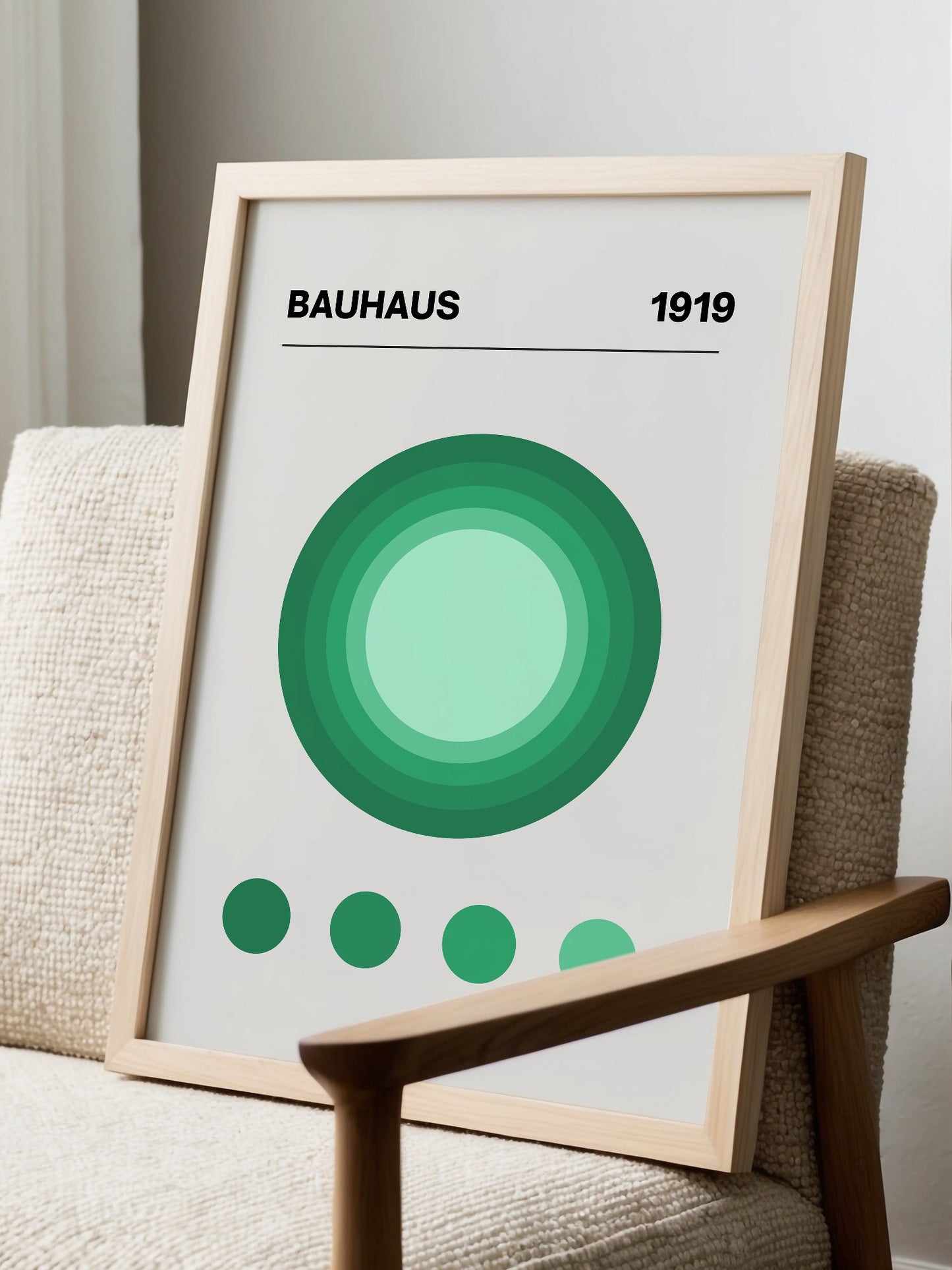 Bauhaus 1919 poster with concentric green circles in gradient shades on beige, displayed in modern living room setting