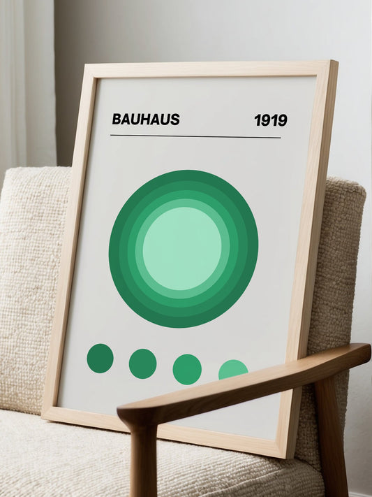 Bauhaus 1919 poster with concentric green circles in gradient shades on beige, displayed in modern living room setting