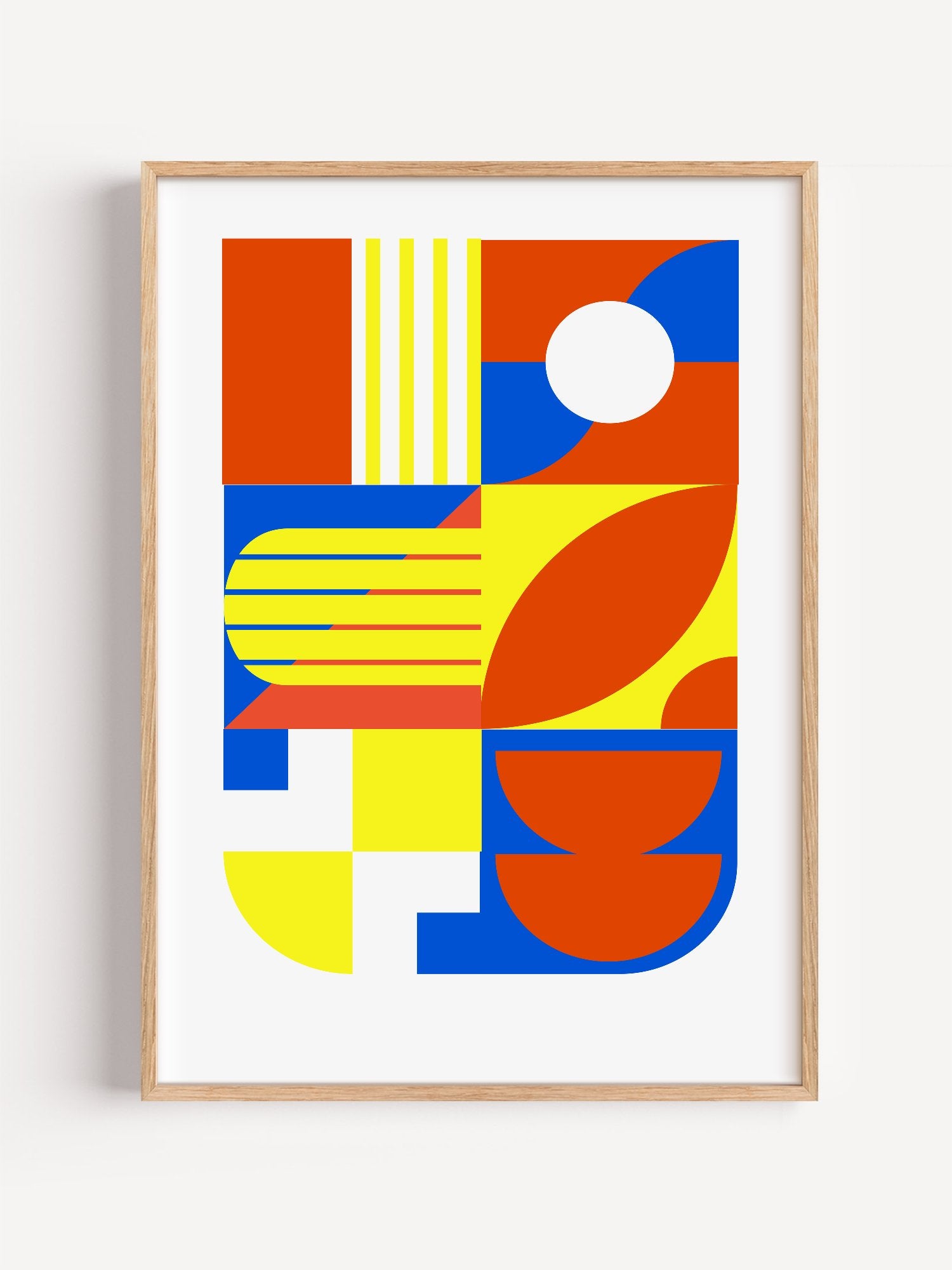 Abstract geometric wall art with interlocking orange, blue and yellow shapes, close-up showing print texture and color detail