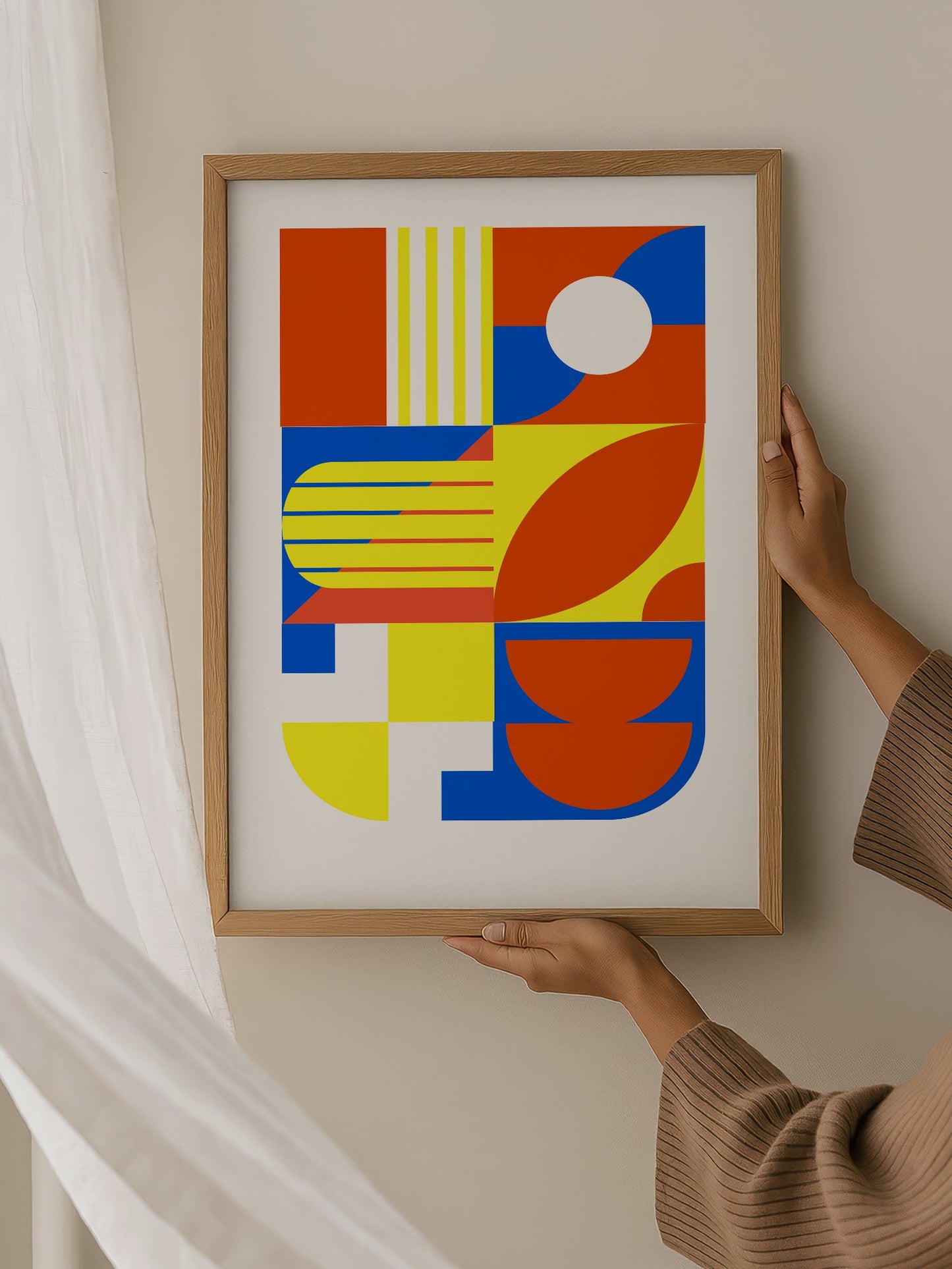 Abstract geometric wall art with interlocking orange, blue and yellow shapes, hanging in contemporary bedroom interior