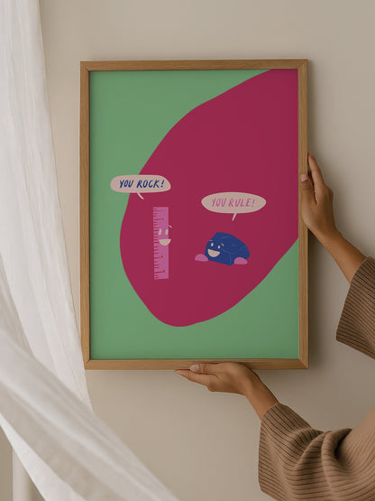 Cartoon ruler and rock character poster with 'You Rock!' and 'You Rule!' speech, hanging in contemporary bedroom interior