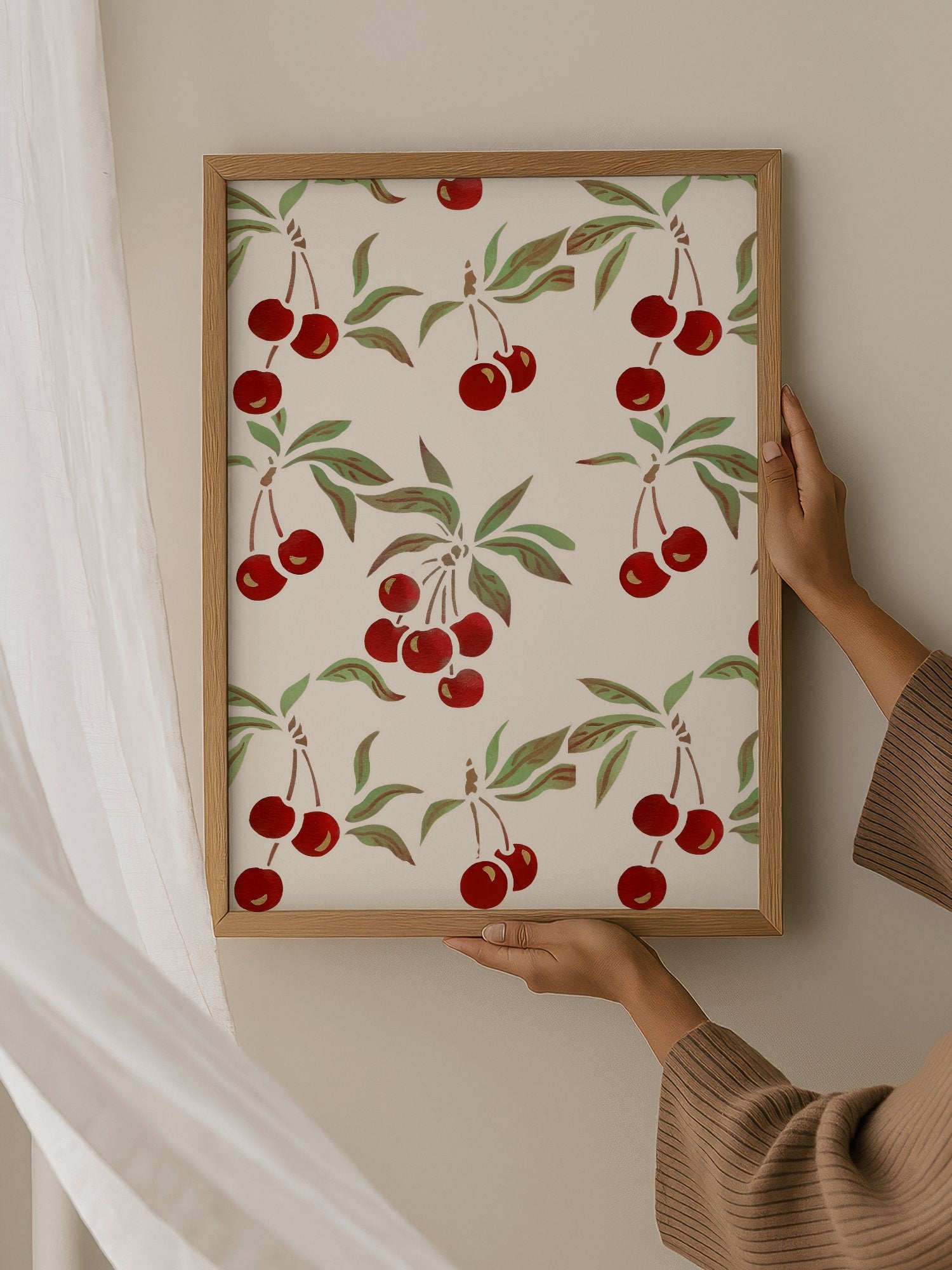 Repeating cherry botanical pattern with red fruit clusters and green leaves on, hanging in contemporary bedroom interior