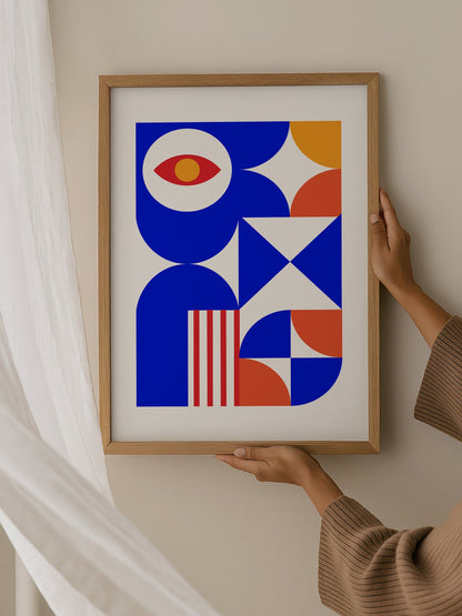 Geometric abstract art print with red eye motif, blue background, coral and, hanging in contemporary bedroom interior