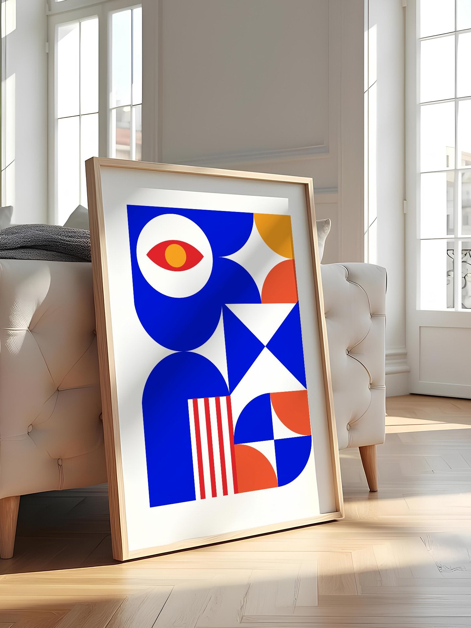Geometric abstract art print with red eye motif, blue background, coral and, featured in stylish apartment decor