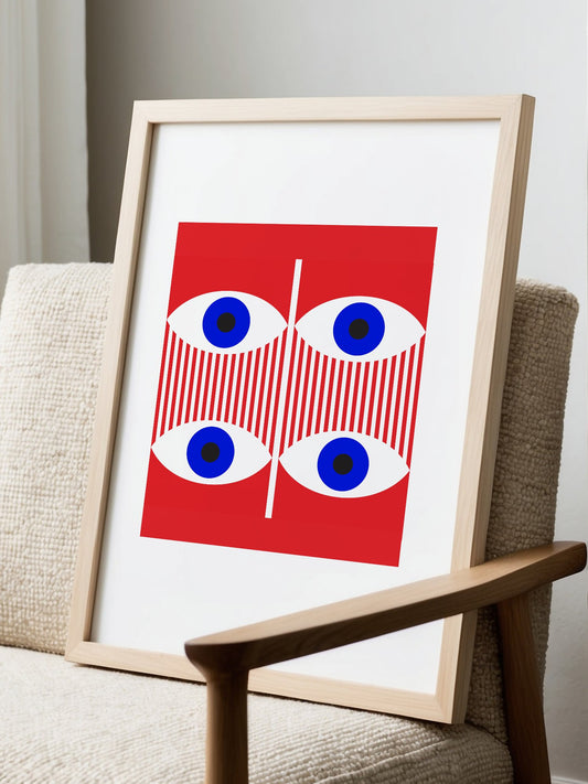 Geometric pop art portrait with four blue eyes in grid pattern on red, displayed in modern living room setting