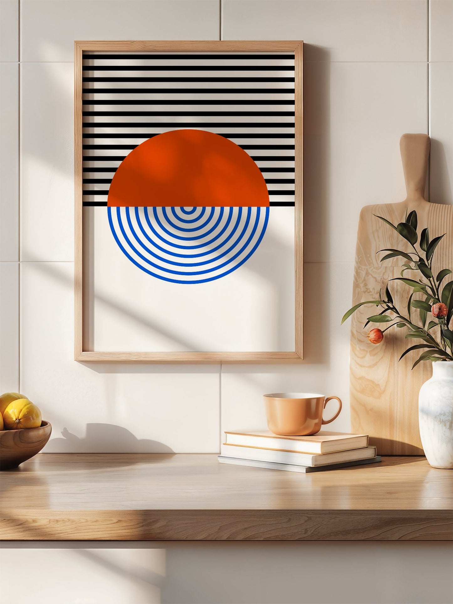 Geometric abstract wall art featuring split circle with orange top and blue, hanging in contemporary bedroom interior