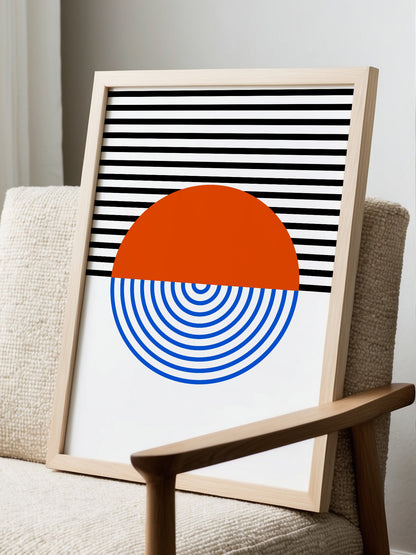 Geometric abstract wall art featuring split circle with orange top and blue, displayed in modern living room setting