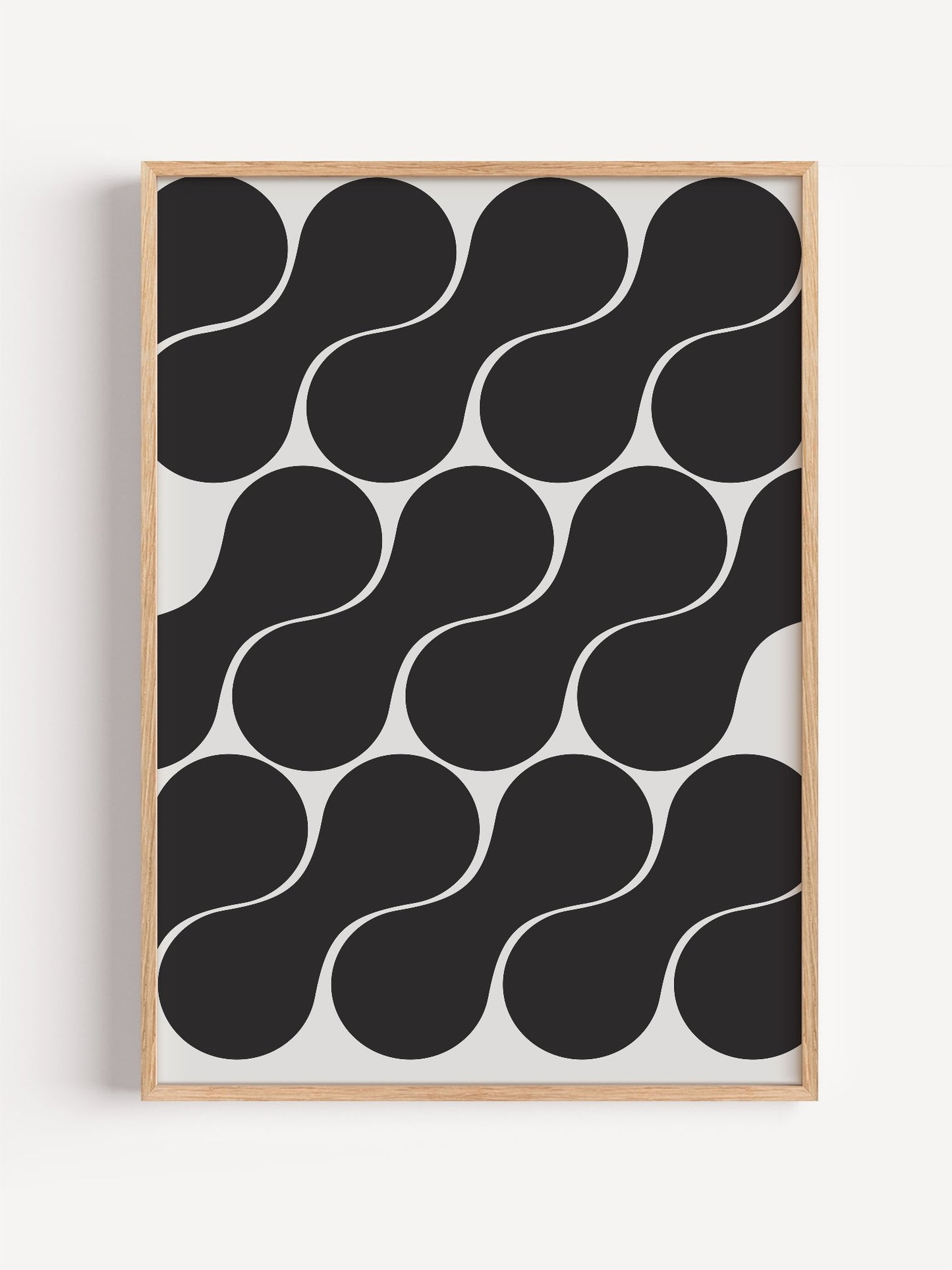 Geometric wall art print featuring interlocking black circles in grid pattern, close-up showing print texture and color de...