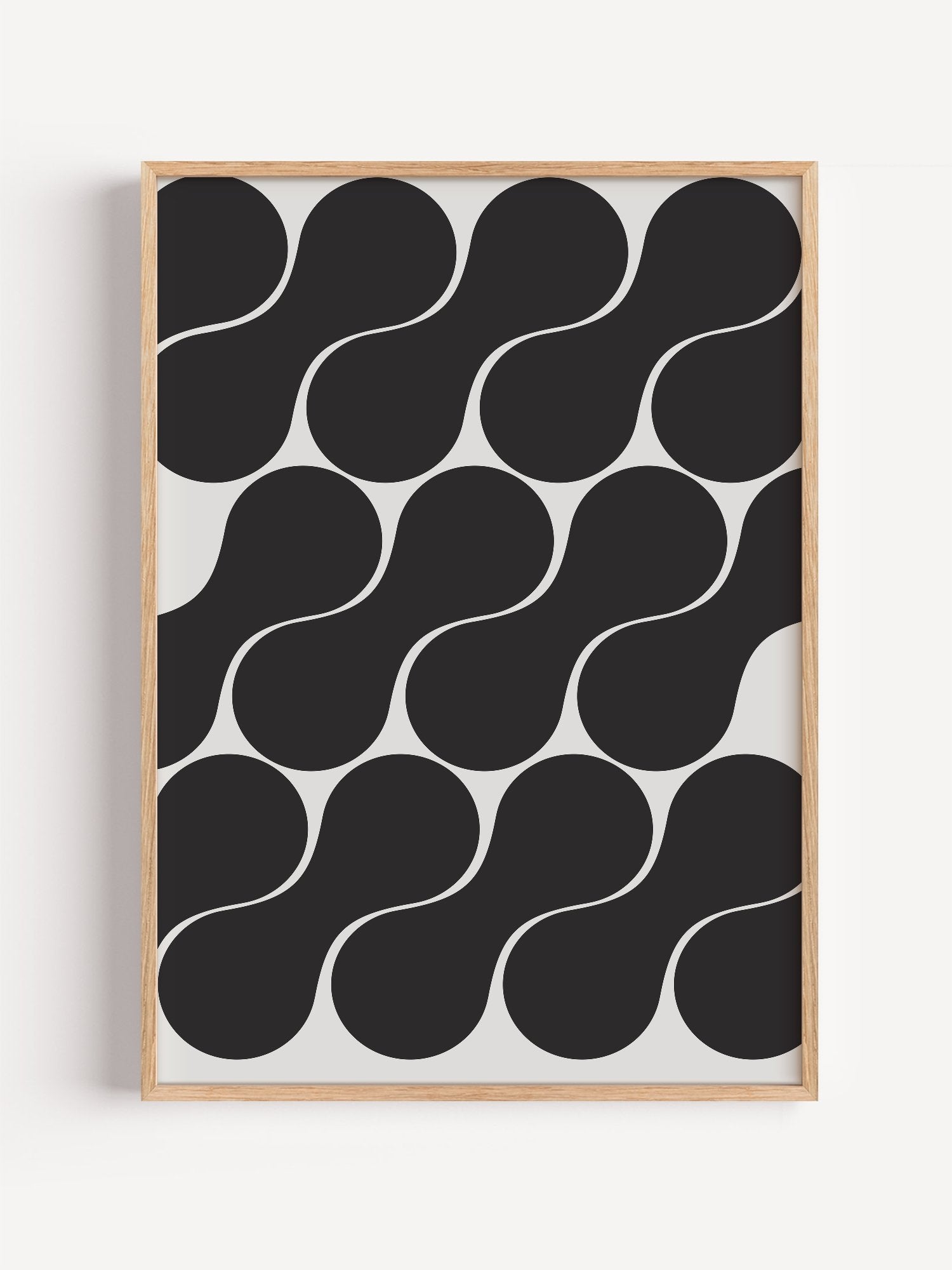Geometric wall art print featuring interlocking black circles in grid pattern, close-up showing print texture and color de...