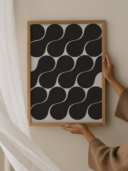 Geometric wall art print featuring interlocking black circles in grid pattern, hanging in contemporary bedroom interior