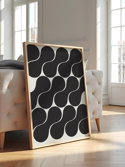 Geometric wall art print featuring interlocking black circles in grid pattern, featured in stylish apartment decor