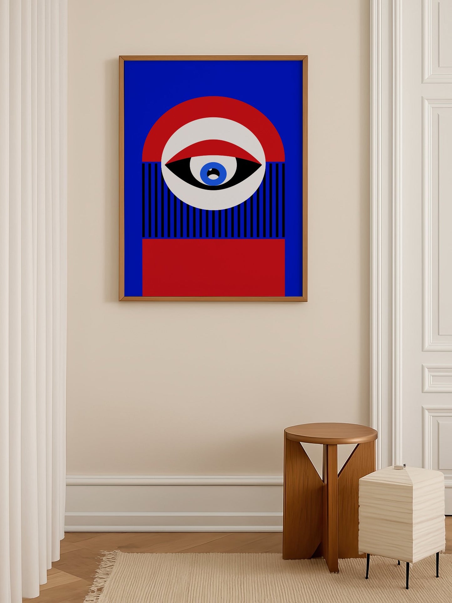 Abstract geometric portrait art with bold central eye motif in cobalt blue, shown in minimalist home office space