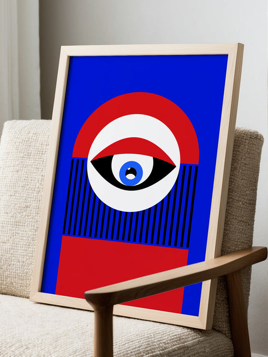 Abstract geometric portrait art with bold central eye motif in cobalt blue, displayed in modern living room setting